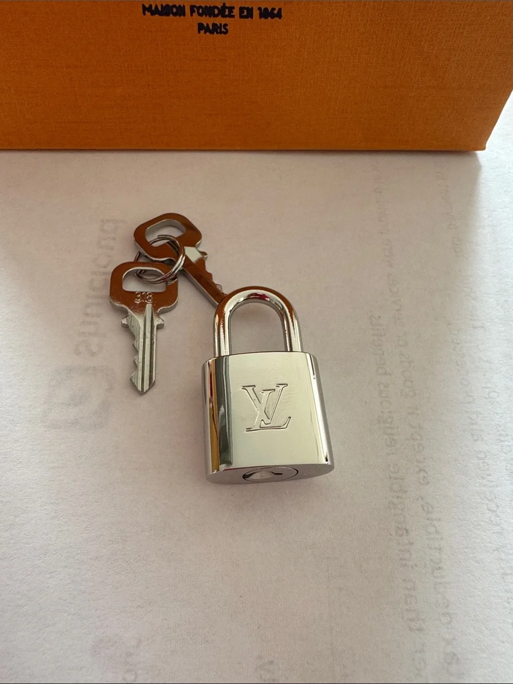 Louis Vuitton Silver Padlock and Key Set